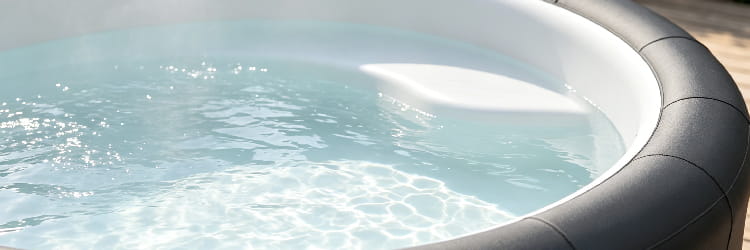 1783062547300124.png alt=Detailed view of hot tub water surface showing clarity and the white interior shell.png